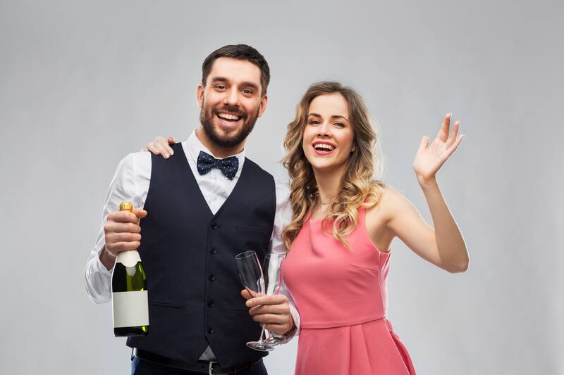 Couple celebrating with champagne at a formal event